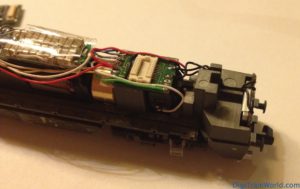 Vossloh G2000 Next 18 DCC conversion: Next18 adapter in place and soldered